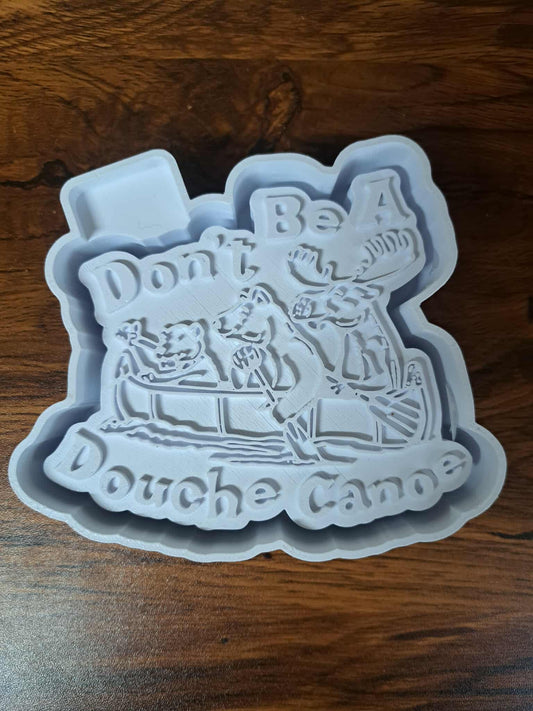 Douche Canoe text on a 3D Housing  on a wooden surface used to produce silicone molds
