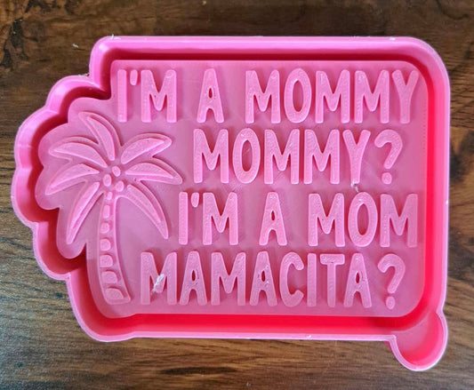 Pink 3d mold housing with "im a mommy "  text and palm tree design on a wooden surface used to sell silicone molds