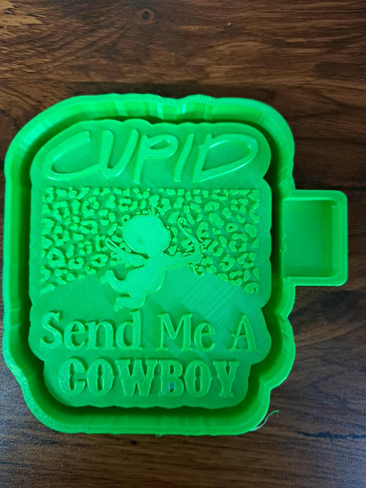 Green 3D mold housing with 'Send Me A Cowboy' text on a wooden surface used for us to sell silicone molds