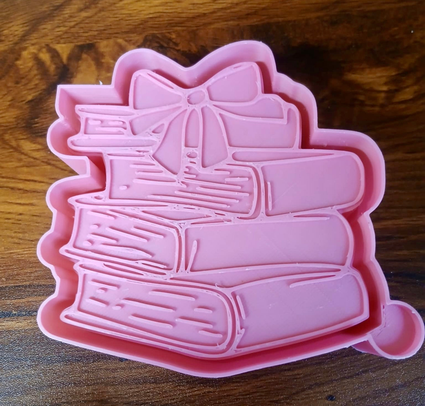 Books stacked with Bow Mold